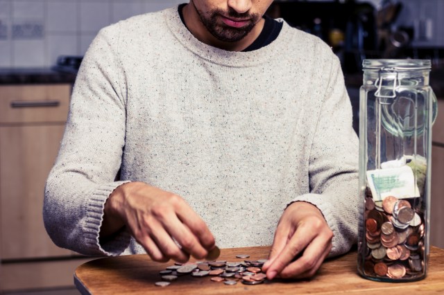person counting coins